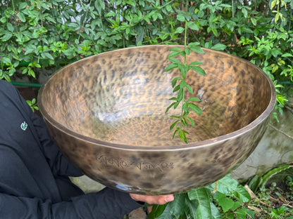 Antique-finish 20-inch Tibetan singing bowl with engraved symbol