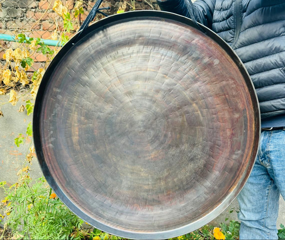 Hand-hammered Himalayan gong with mallet for sound-therapy sessions