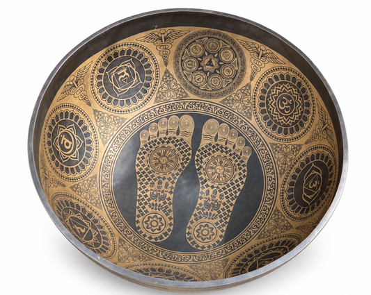 Interior view of sacred footprints engraved inside a large singing bowl