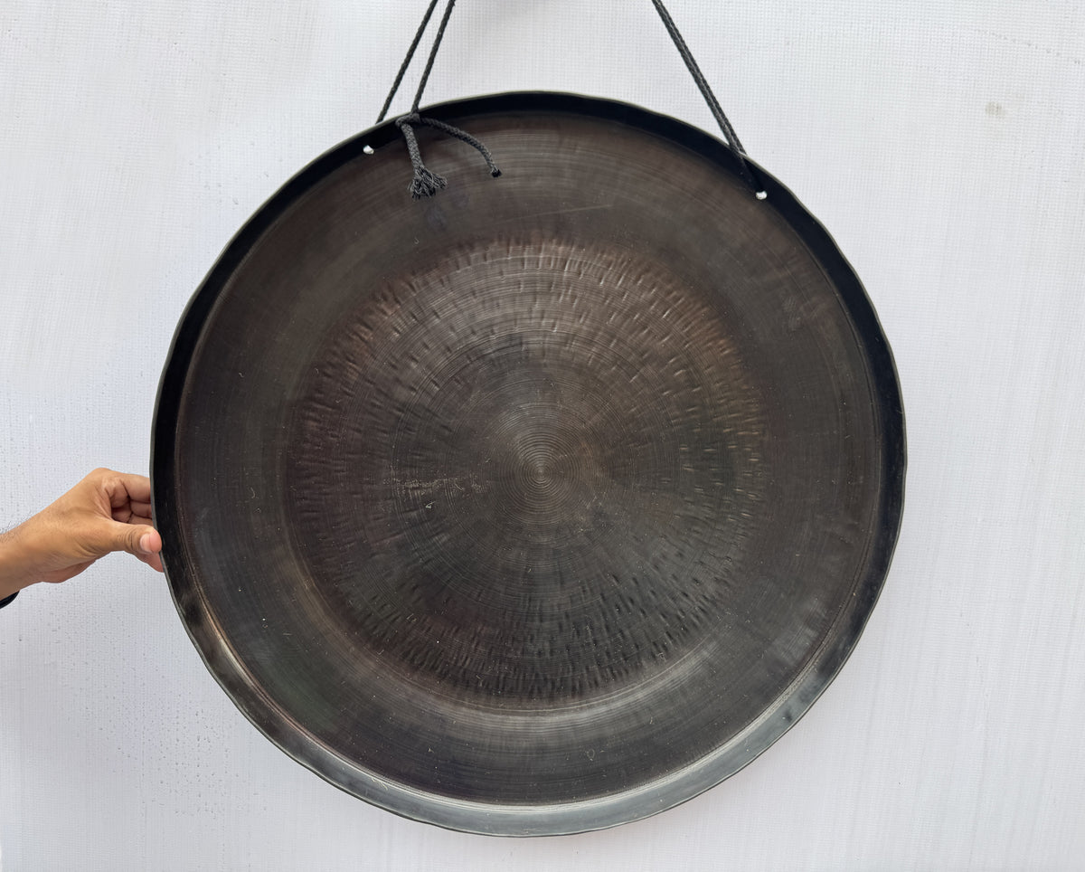 Lotus design carved on handcrafted Tibetan gong