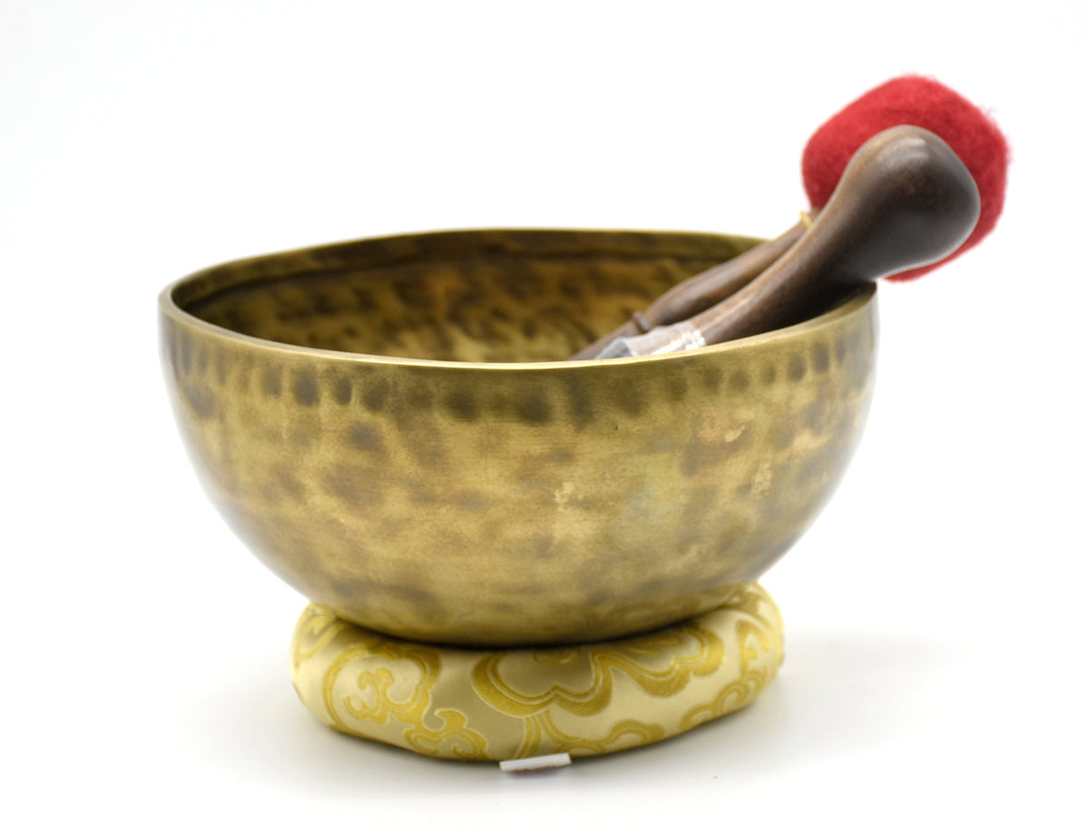 Nine-inch Himalayan meditation bowl displayed on its cushion
