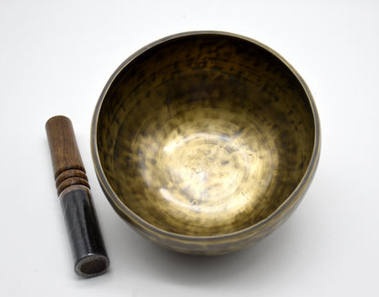 Seven-inch meditation singing bowl resting on a handmade cushion