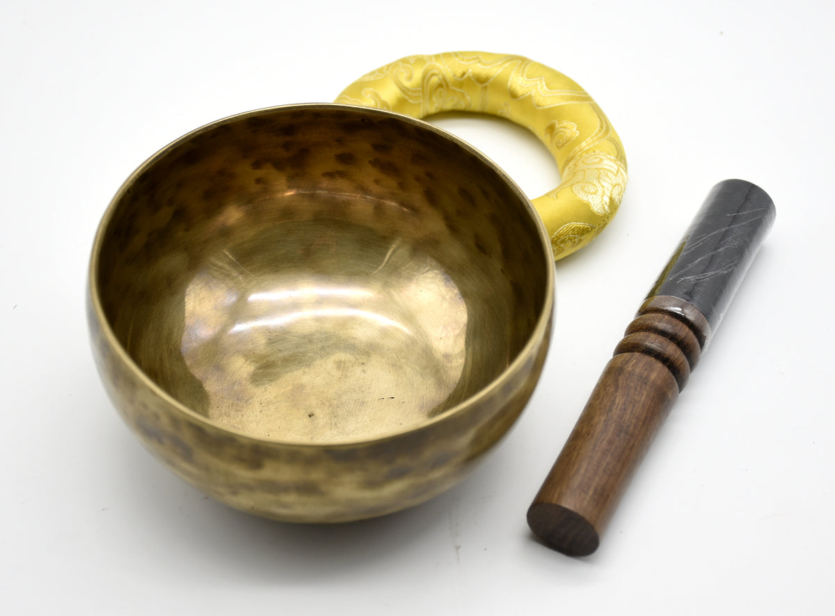 Six-inch Himalayan singing bowl resting on a handmade cushion