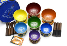 Handcrafted Tibetan singing bowl set of 7 in chakra colours with mallets, cushions and carry case, made in Nepal.